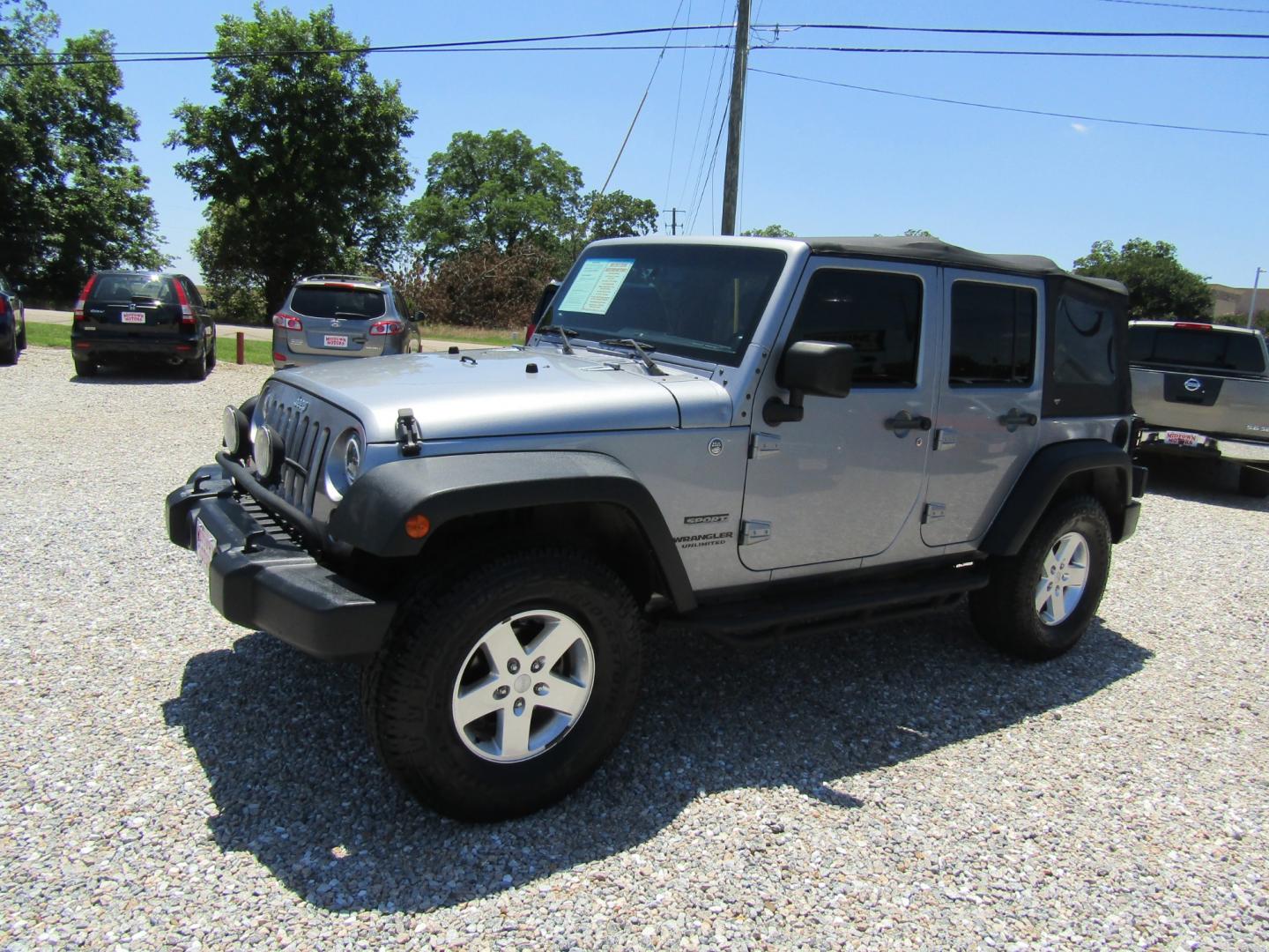 2013 Silver Jeep Wrangler Unlimited Sport 4WD (1C4BJWDG2DL) with an 3.6L V6 DOHC 24V FFV engine, Automatic transmission, located at 15016 S Hwy 231, Midland City, AL, 36350, (334) 983-3001, 31.306210, -85.495277 - Photo#2